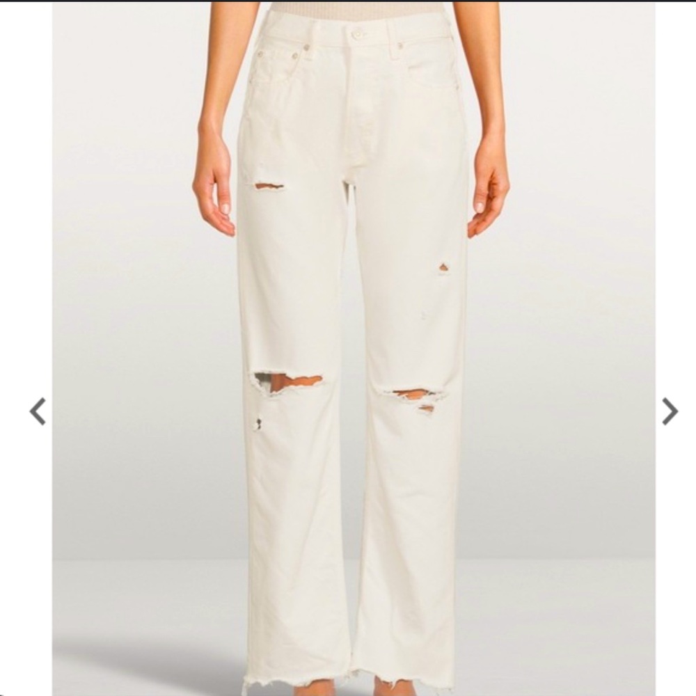 White boot cut with knee slit jeans